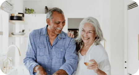 eldery couple cooking in kitchen